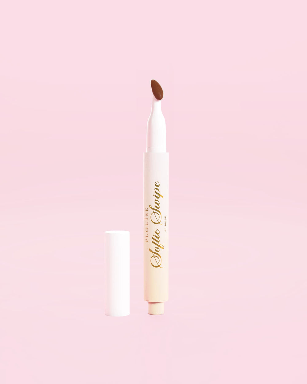 An image of a P.Louise Softie Swipe Tinted Lip Mask in Sweet Spot against a pink background