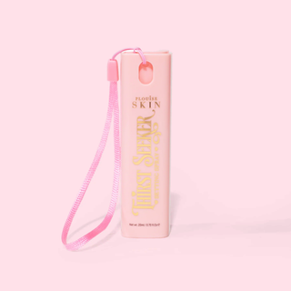 Pink mini keychain P.Louise thirst seeker hydrating setting spray with a strap on a pink background