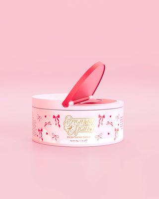 Pink tub of P.Louise Bright By Night Brightening Cream with red bow graphic elements against a pink background