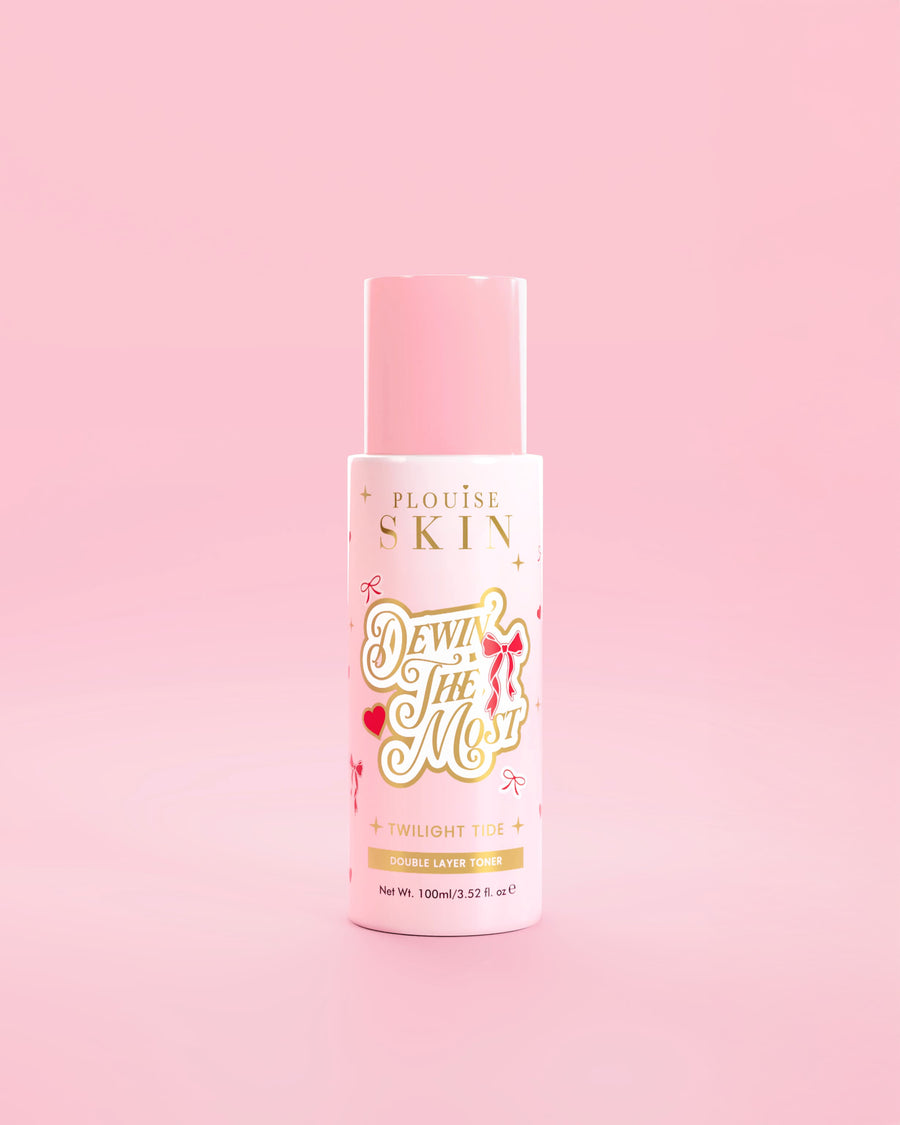 Rosa P.Louise-Flasche Dewing The Most Double Layer Toner mit roten Schleifenmustern vor rosa Hintergrund