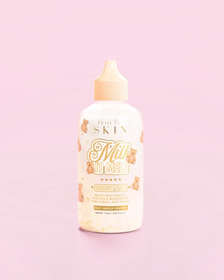 A bottle of the P.Louise Milk It Melt Milky Makeup Remover in coconut cake scent against a pink background