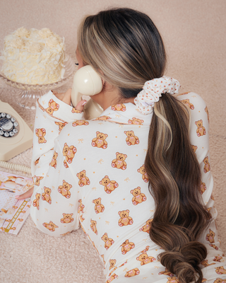Woman wearing a teddy print hair scrunchie